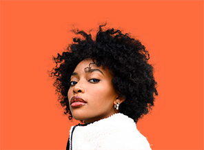 womans portrait on an orange background