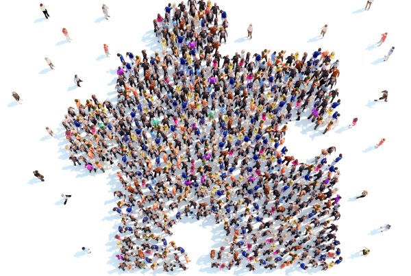 Large group of people in the form of a puzzle. White background.