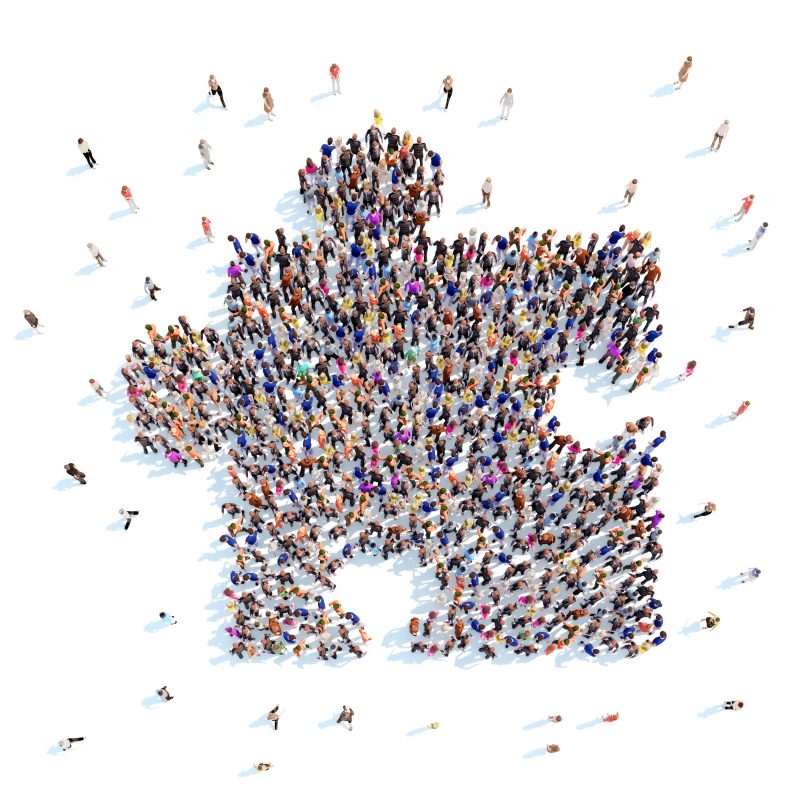 Large group of people in the form of a puzzle. White background.